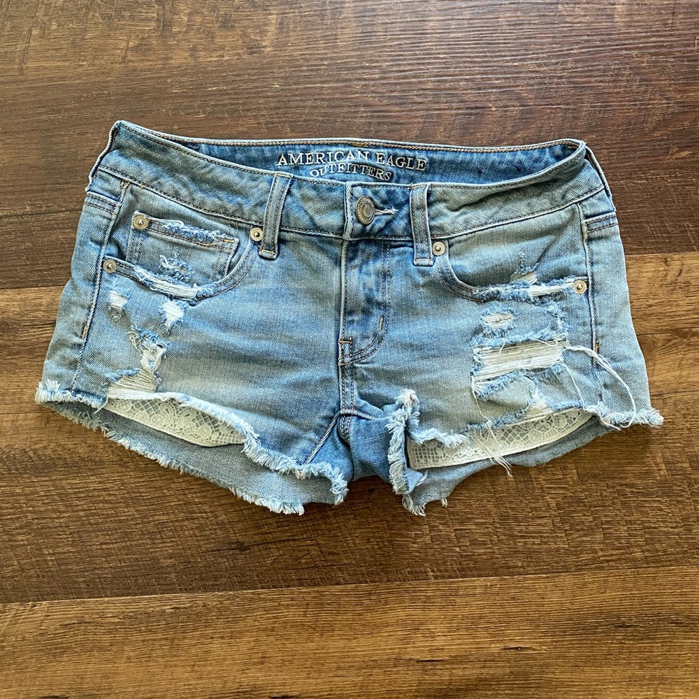 American Eagle super low shortie shorts | light wash distressed denim | size 2